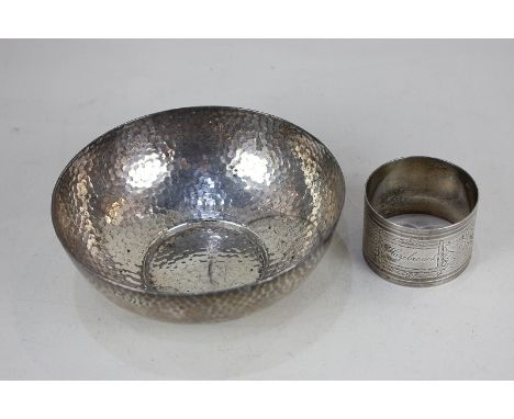 An Arts and Crafts hammered circular bowl, maker Barker Brothers, Chester 1910, 5.3oz, 13cm diameter, and a single French sil