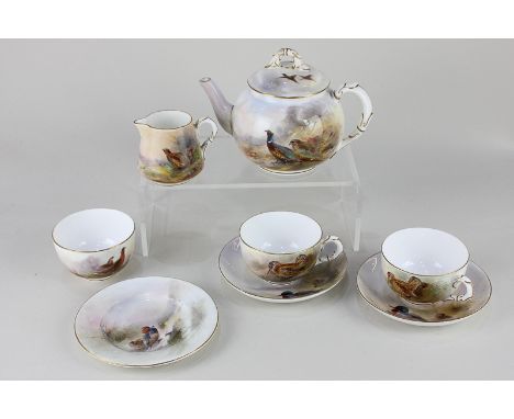 A Royal Worcester porcelain tea set decorated by James Stinton, decorated with birds including pheasant, godwit and mallard, 