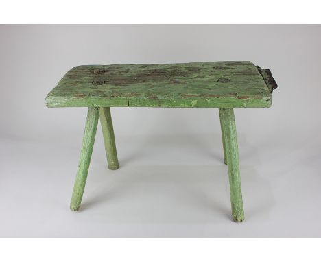 A green painted oak skinning stool with metal mounted (blunt) blade, 50.5cm