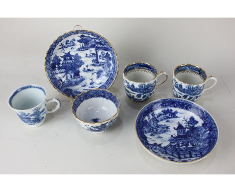 A pair of late 18th / early 19th century blue and white coffee cups, fluted shape with scroll handles and chinoiserie decorat