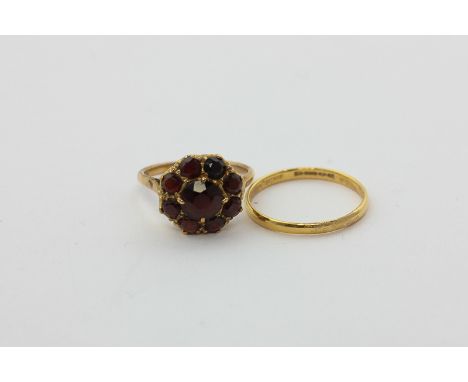 A 22ct gold wedding ring, 1.3g, and a garnet cluster ring in 9ct gold
