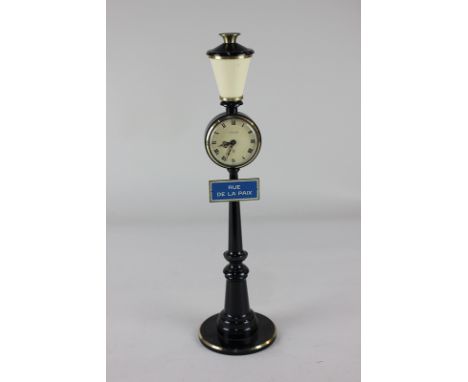 A Jaeger LeCoultre novelty clock, in the form of a Paris street lamp, with road sign Rue de la Paix, 28cm high