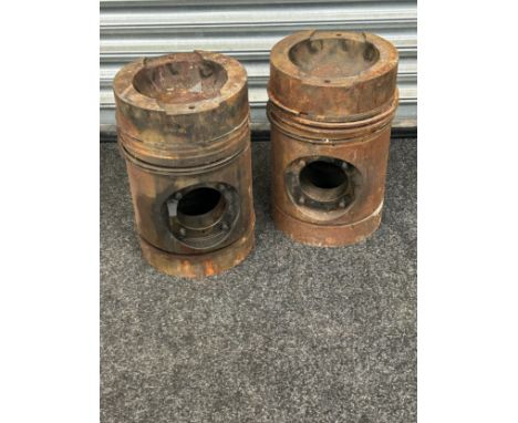 Pair of large engine pistons measures approx 15.5 inches tall by 10 inches wide