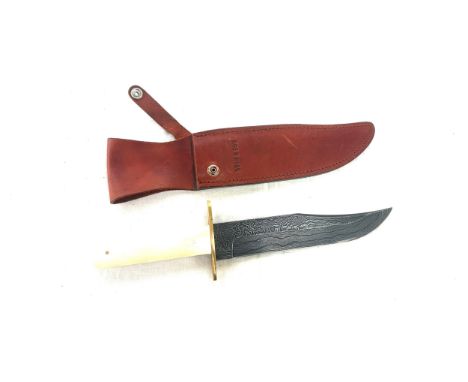 Bear and sons knife in a leather holster 