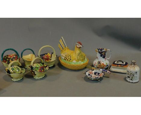 A collection of Art Deco Tuscan Decoro pottery baskets and other ceramic items. 