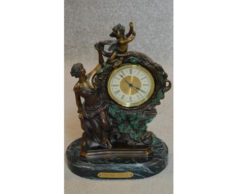 An ornate French style mantel clock on marble base. H.35cm 