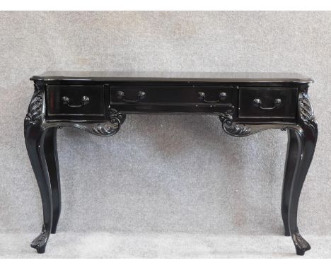 A French style ebonised console table fitted frieze drawers on cabriole supports. H.77 W.118 D.75cm 