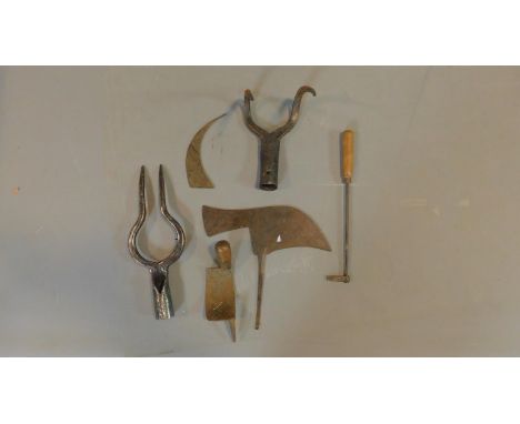 A miscellaneous collection of vintage and antique metal garden tools.