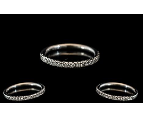 A Platinum Diamond Half Eternity Ring set with round, modern brilliant cut diamonds, fully hallmarked, ring size K 1/2. Weigh