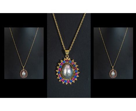 14ct Yellow Gold - Attractive Sapphires and Rubies Set Ornate Oval Shaped Pendant Drop with gold chain. The Rubies and Sapphi