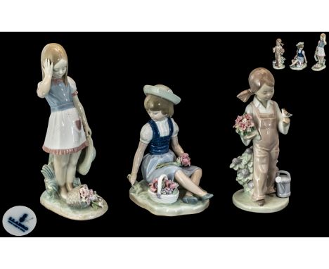 Collection of Three Lladro Figures, comprising Lladro Daisa No.1287, Girl picking wild flowers, 6.5'' tall; Lladro Girl Holdi