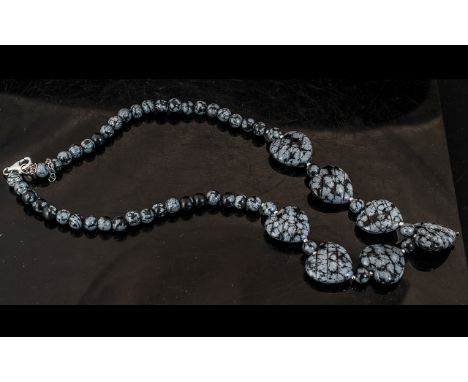 Snowflake Obsidian Pendant Necklace, comprising six heart shaped, carved and polished pieces of the variegated variety of obs