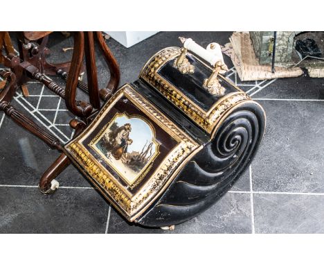 A Victorian Tin Coal Scuttle with painted front depicting children, ceramic handle complete with shovel and liner. 