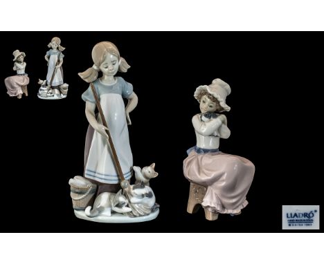 Lladro Figure No. 5232 'Girl with Playful Kittens' a girl with a mop and bucket and three playful kittens.  Measures 9'' tall