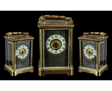 An English Brass Carriage Clock of typical form, white chapter dial with Arabic Numerals, marked William Angus 27 Lord Street