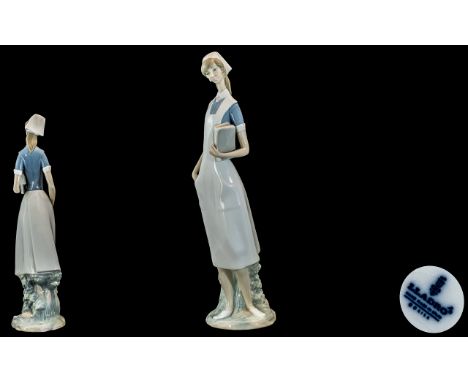 Lladro - Hand Painted Porcelain Figurine ' Nurse ' Model No 4603. Issued 1969 - 1978. Height 15.75 Inches - 39.50 cms. With B