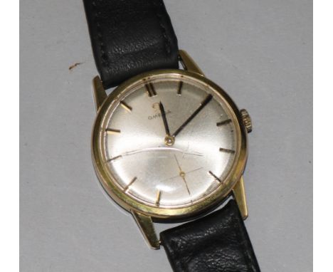 A gentleman's gold plated Omega manual wind wrist watch.