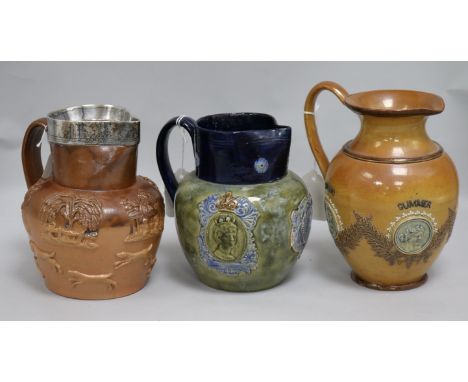 A Royal Doulton George V coronation jug, glazed in blue and green, a Doulton Lambeth 'four seasons' stoneware jug and another
