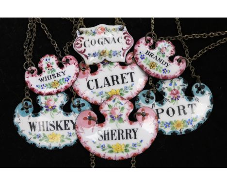 Seven enamelled wine labels