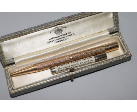 A late 1920's engine turned 9ct gold pencil.