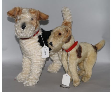 A Steiff 'Foxy' Fox Terrier, model no. 931717, height 13.5ins (button in ear) and another smaller plush Fox Terrier