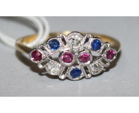 A 15ct gold, ruby, sapphire and diamond set elliptical shaped ring, size Q.