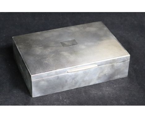 A late 1950's engine turned silver cigarette box, 17cm.