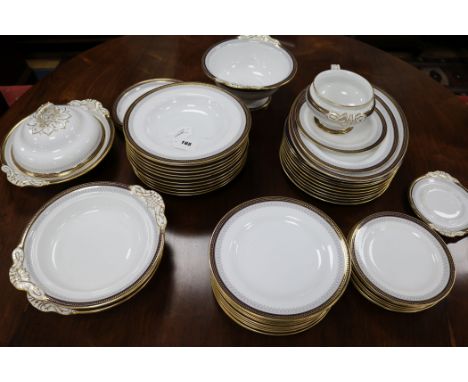 A Spode Copeland part dinner service retailed by Harrods, pattern no. 7029, with deep blue and gilt decorative borders (appro
