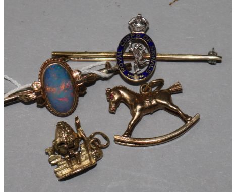 A 15ct gold, enamel and diamond set Royal Corps of Signals brooch, two 9ct gold charms & a 9ct gold brooch.