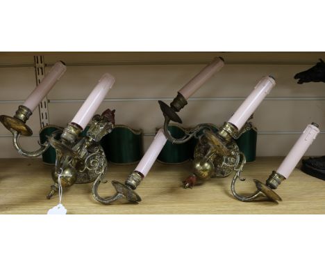 A pair of Edwardian Dutch brass three branch wall lights and a firescreen