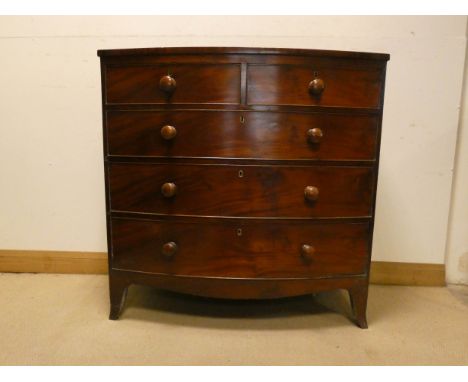 A late Georgian mahogany bow front chest of three long and two short drawers with later Victorian bun handles, 3'6 wide 