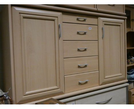 A modern light beech sideboard fitted five centre drawers and cupboards 4'6 wide 