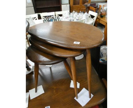 A nest of three oval shaped top Ercol coffee table in the Golden Dawn colour   Generally good condition for age, a few minor 