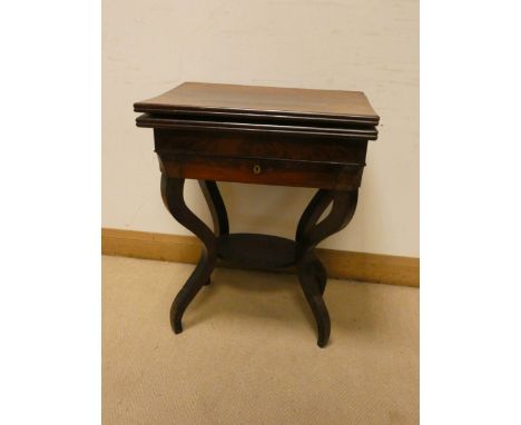 A mahogany folding top card table fitted drawer with a shelf under on four shaped legs 22" wide 