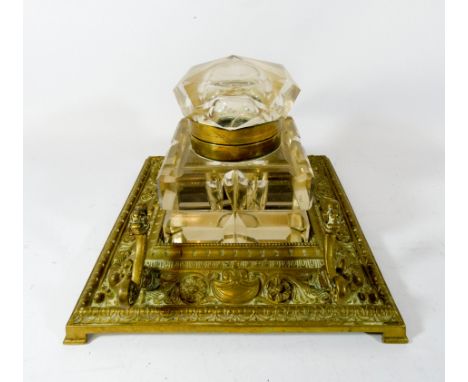 A Victorian brass desk stand with faceted glass inkwell, the desk stand measures 18cms square 