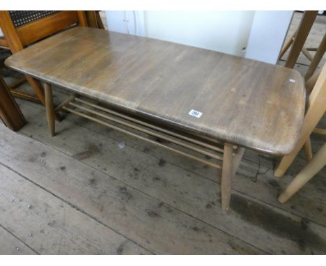 A long Ercol oak coffee table (needs polish) 