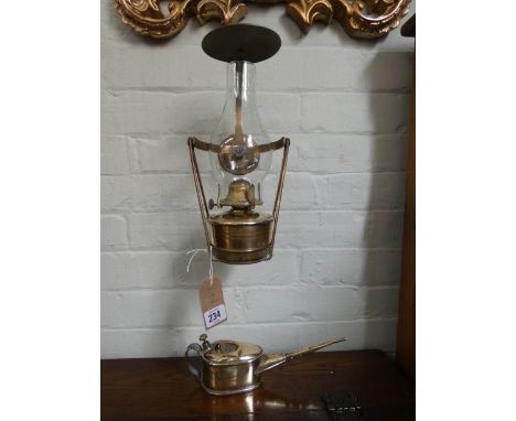 A wall fixing brass oil lamp and an old polished brass oil can 