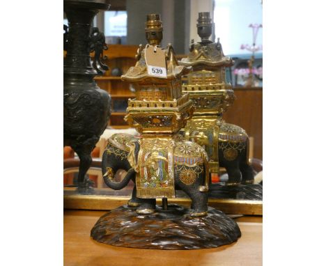 A Satsuma elephant and Howdah lamp base on a naturalistically carved hardwood base, overall height to top of fitting 41cms   