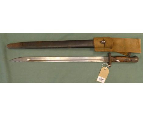 The Lee Enfield British bayonet in its leather scabbard with steel mount and complete with canvas frog, blade length 43cm