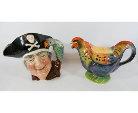 Art Deco Rooster teapot together with a Royal Doulton character jug Long John Silver 