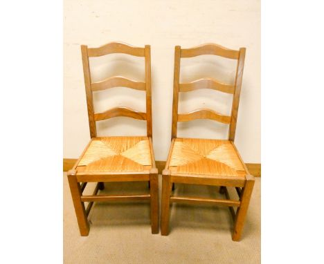 A set of seven ladder back chairs which match the previous six 