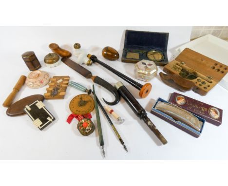 A tray of collectibles to include a Hohner harmonica, paper knife, doorbells, snuff shoes etc  