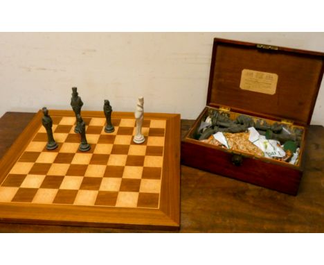 A set of Chinese design chess pieces in mahogany box and a chessboard