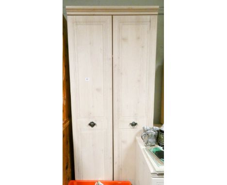 A modern two door light beech wardrobe 2'6 wide 