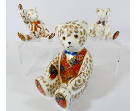 A Royal Crown Derby seated Teddy bear paperweight and two bear figures, Teddy Edward with blue spotted bow tie and Alice Bear