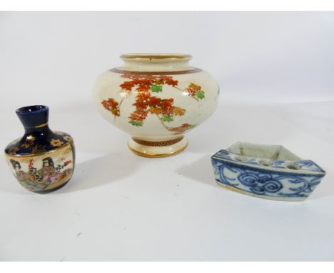 Three pieces of oriental pottery to include a blue and white inkwell 