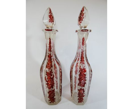 A pair of Victorian Bohemian ruby flash glass liquor decanters, 34cm tall