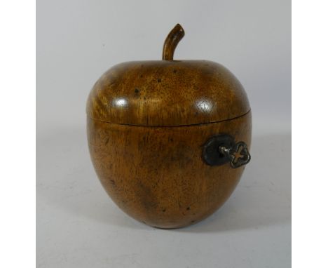 A Georgian style fruitwood apple shaped tea caddy 14cms tall 