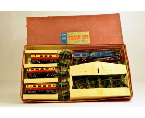 Chad Valley De Luxe Train Set. Comprising blue clockwork locomotive and 2 x first class coaches and passenger guards van in r