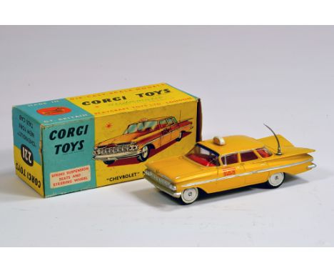 Corgi No. 221 Chevrolet Impala New York Taxi Cab. Yellow with unusual (possibly superdetailed) silver trim. E to NM in VG Box